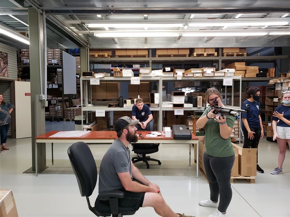 Gunsmith Austin Cook helps Air Rifle Team Captain Cadet Burke with firing techniques - 27 AUG 2021